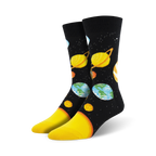 Pair of crew socks with a black background showcasing colorful planets and stars.  A fun, cosmic design.