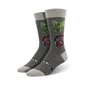 Pair of grey crew socks with a graphic of a beet wearing headphones.  Features green beet greens and a black banner.