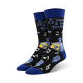 Pair of black crew socks with blue cuffs. Design features a cartoon guitarist, musical notes, and microphones.