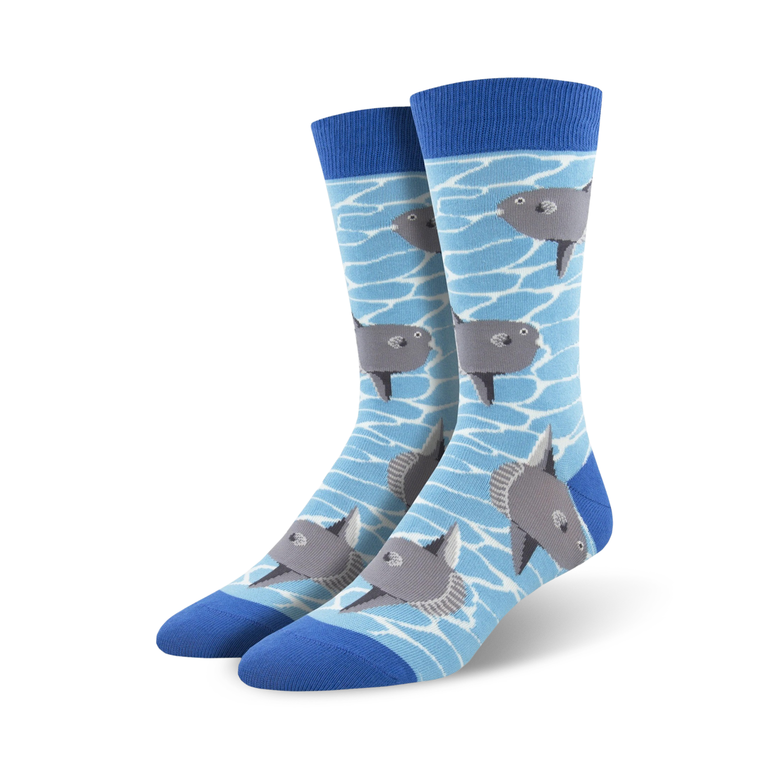 A pair of crew socks with a light blue background and illustrated gray ocean sunfish swimming. The socks have a royal blue cuff.