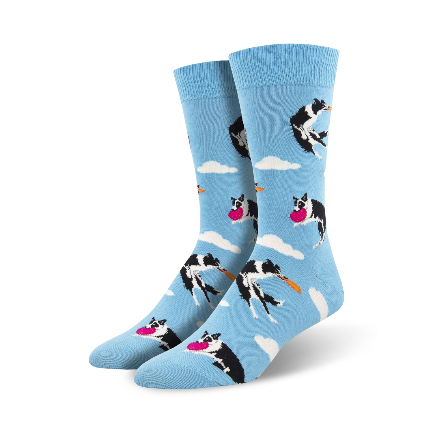 A pair of crew socks in light blue.  The design features black and white border collies catching pink frisbees against a cloudy sky.