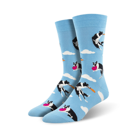 light blue crew socks with black and white border collies catching pink frisbees  