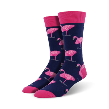 flamingo xl socks in dark blue with pattern of pink flamingos standing on 1 leg in light blue circles. men's crew socks. 
