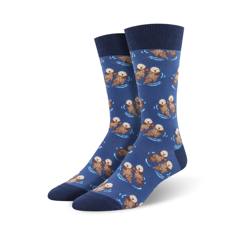 A pair of men's crew socks in navy blue, featuring a repeating pattern of brown otters playfully swimming. XL size.