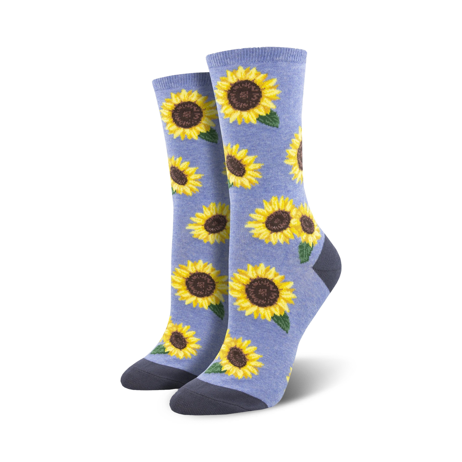 Lifestyle shot showing a person wearing the light blue sunflower socks. The socks look soft and comfy and are stylishly paired with other clothing items