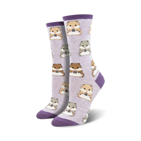 purple crew socks feature a pattern of cartoon hamsters feasting on sunflower seeds.  