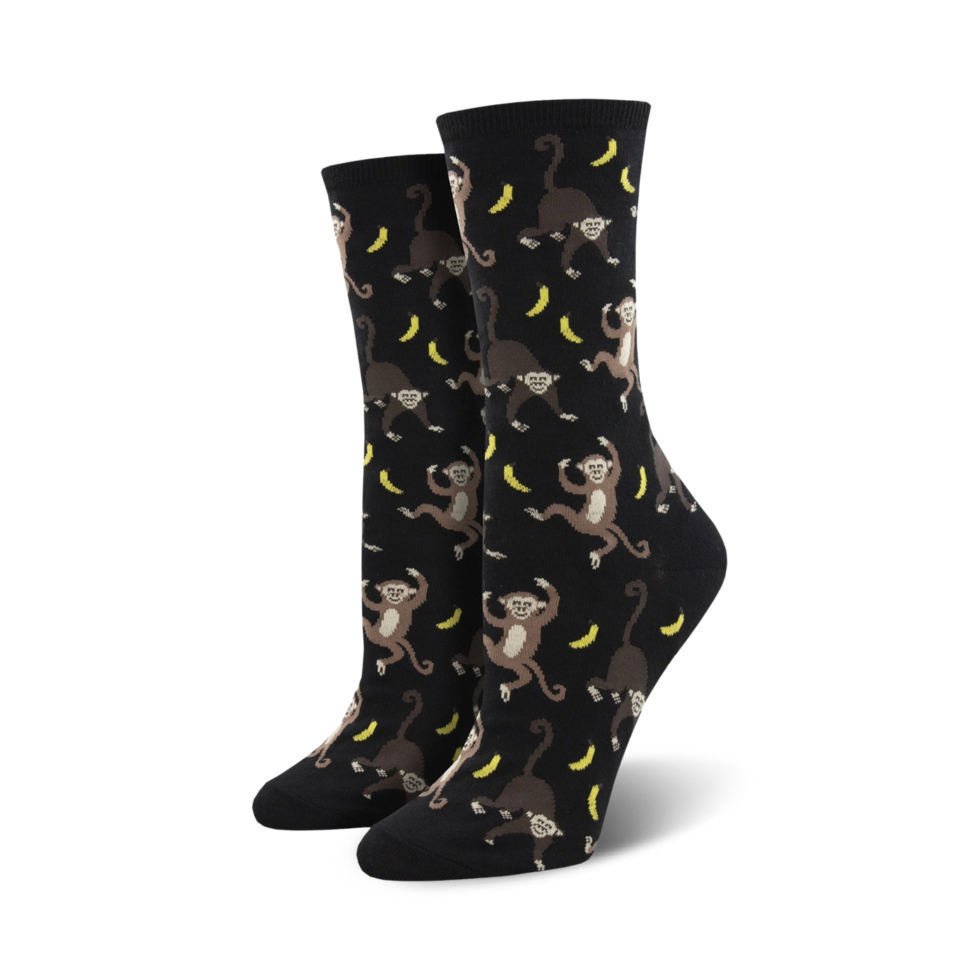 Pair of black crew socks with a playful all-over print of monkeys swinging from bananas. 