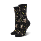 Pair of black crew socks with a playful all-over print of monkeys swinging from bananas. 