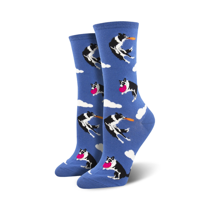  women's crew socks featuring a pattern of black and white border collie dogs leaping to catch a frisbee against a background of white clouds on a blue sky.  
