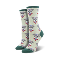 Lifestyle shot of a person's feet wearing the sage green Snazzy Schnauzer socks. The socks are shown on a wooden floor.