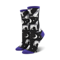 A pair of women's crew socks. Black background with a pattern of howling wolves, moons, and stars. Purple cuffs.
