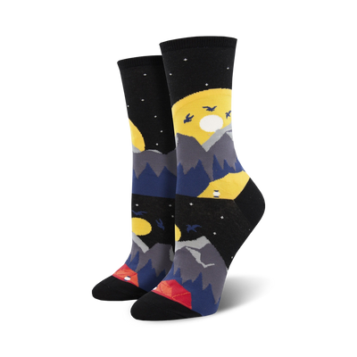 black crew socks with a pattern of blue and gray mountains, yellow moons, red and orange tents, and white stars. perfect for camping and hiking enthusiasts.  