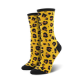 Pair of women's crew socks in mustard yellow with a black leopard print.  Black toe and heel.