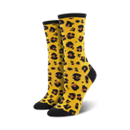 Pair of women's crew socks in mustard yellow with a black leopard print.  Black toe and heel.