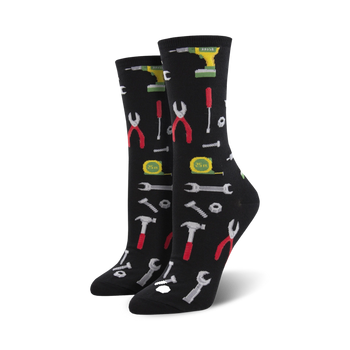 black crew socks adorned with a pattern of wrenches, screwdrivers, pliers, hammers, nails, nuts and bolts. 