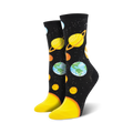 Crew socks with a black background, featuring colorful planets, stars, and yellow soles.  A fun, space-themed design.