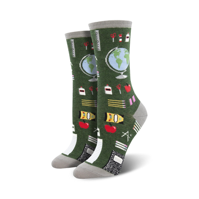 dark green study buddies crew socks made for women feature a colorful pattern of school supplies.    