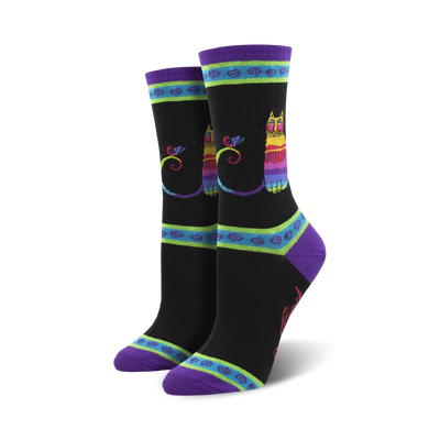 laurel burch rainbow cat crew socks for women showcase a vivid cat and bird pattern. funky geometric accent around the ankle. purple toe, heel.  