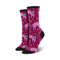 A pair of women's crew socks in burgundy with a pattern of pink dogs with hearts and small white hearts.