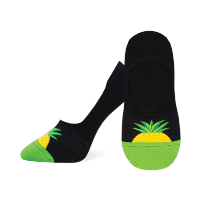 A pair of black and lime green no-show socks with a yellow pineapple design on the heel. The socks are low-cut and comfortable.