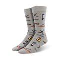 Pair of grey bamboo crew socks with a fun pattern of barber tools like scissors, combs, razors, and a barbershop pole.