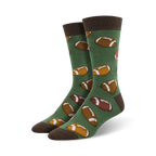 Pair of green crew socks with brown football designs. Brown cuff.  Fun, casual style.