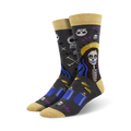 A pair of crew socks in dark grey with a Day of the Dead themed design. The main image shows a woman with sugar skull makeup, candles, and skulls.