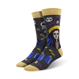 mid-calf length voodoo skull, bone, and flower design socks featuring a yellow toe and heel with the word "voodoo" on the bottom. 