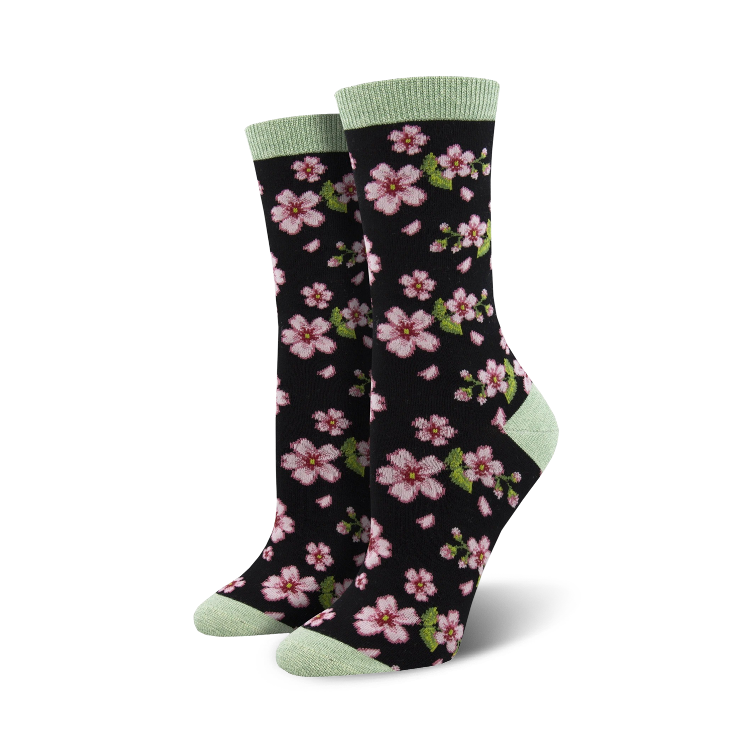 Pair of women's crew socks in black with pink cherry blossom design and light green cuffs.
