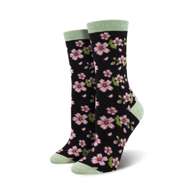 black crew socks with pink cherry blossom and green leaves pattern for women.  