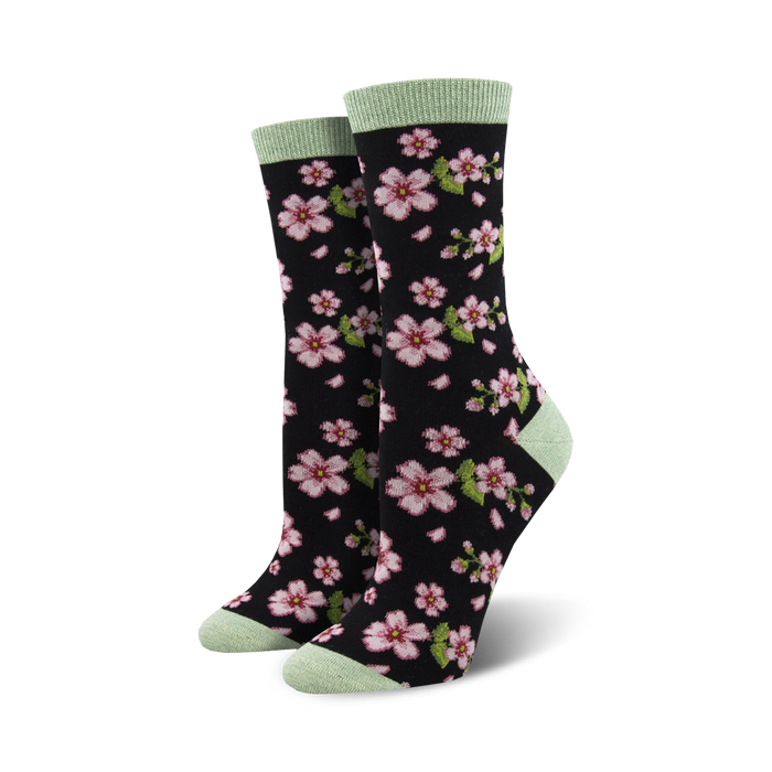 black crew socks with pink cherry blossom and green leaves pattern for women.  