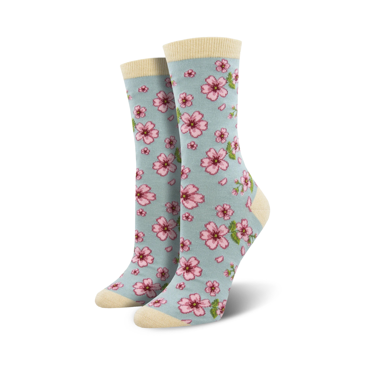 Lifestyle shot of a woman's feet wearing light blue cherry blossom socks.