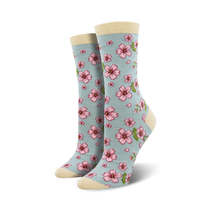 light blue floral crew socks with pink flowers, green stems & yellow centers. for women, crew-length.   