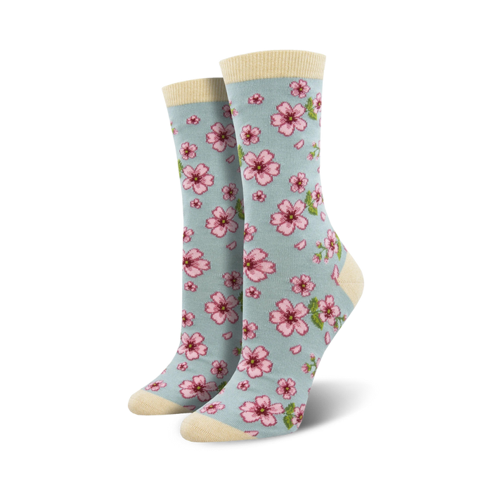 light blue floral crew socks with pink flowers, green stems & yellow centers. for women, crew-length.   