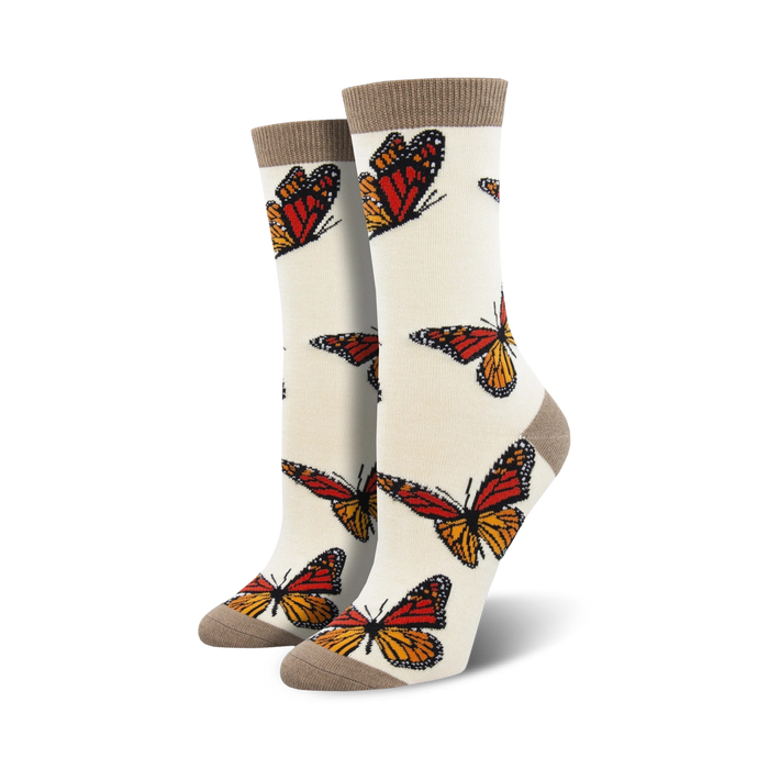 womens' crew socks made of bamboo feature monarch butterfly pattern in orange, black, and white.   