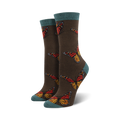 Close-up of a pair of dark brown crew socks with teal cuffs, showcasing the monarch butterfly design.