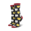 Crew socks with a charcoal grey background featuring a repeating pattern of cute orange and white cat faces. Red trim at the top.