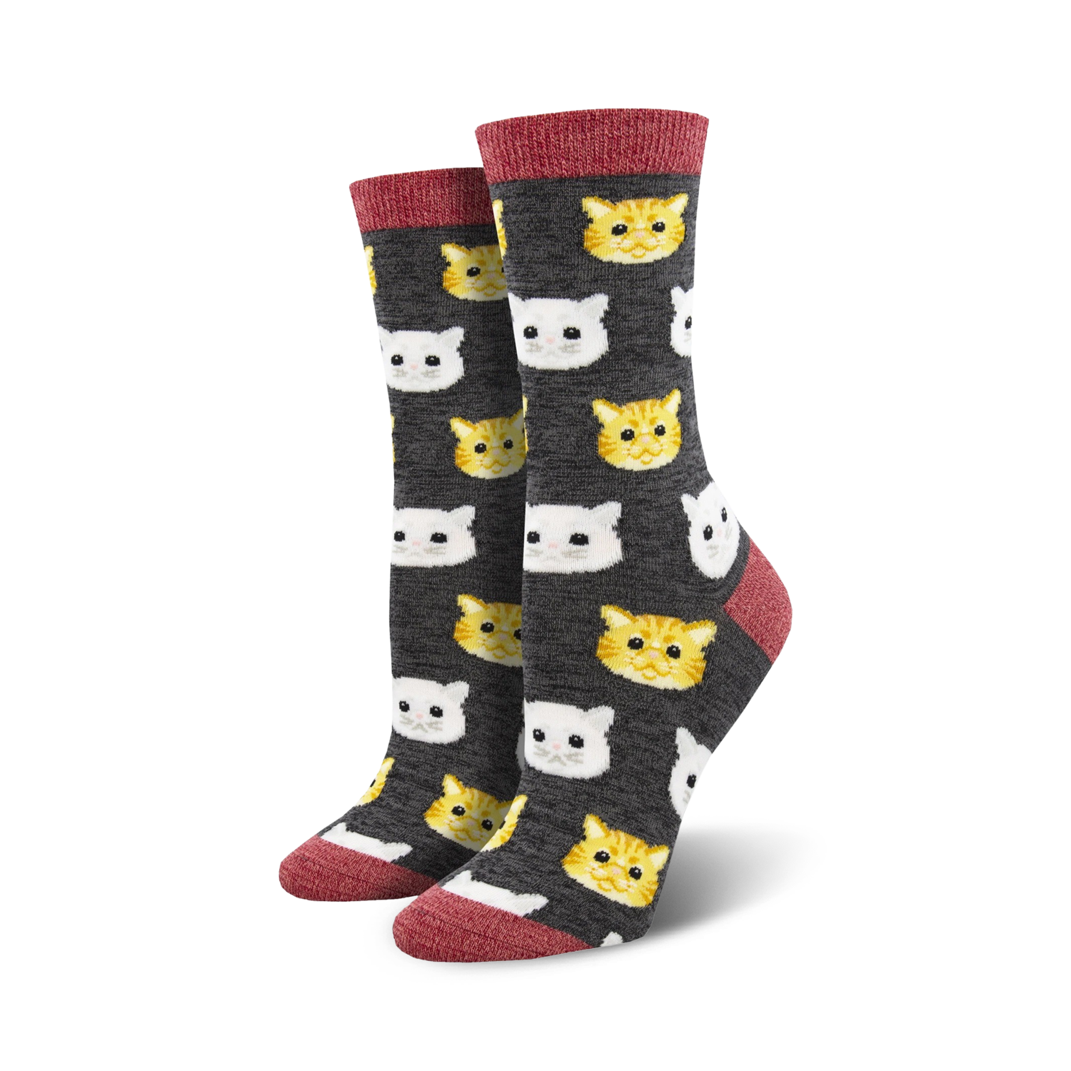 Crew socks with a charcoal grey background featuring a repeating pattern of cute orange and white cat faces. Red trim at the top.