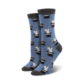 A pair of women's crew socks in blue with a pattern of white rabbits popping out of black top hats.