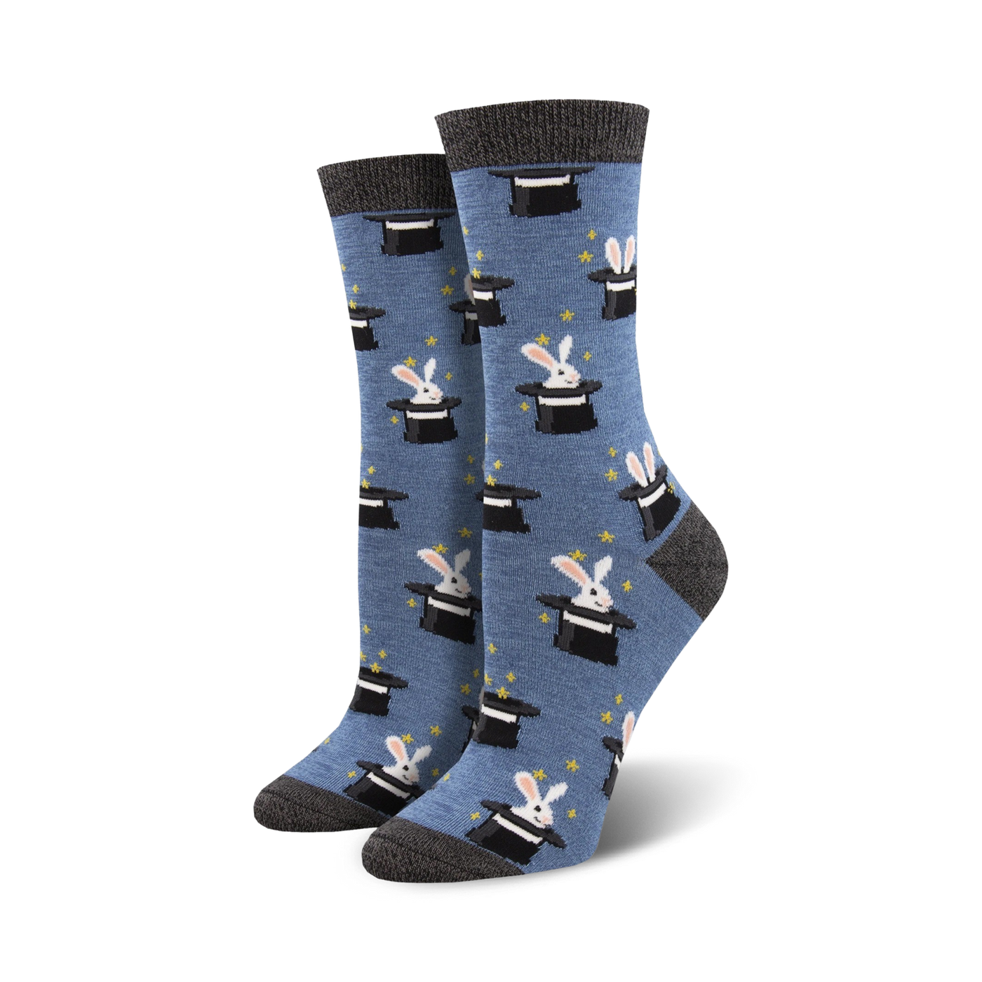 A pair of women's crew socks in blue with a pattern of white rabbits popping out of black top hats.