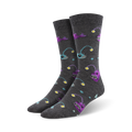 Pair of charcoal grey crew socks with a pattern of purple and teal anglerfish and yellow lights. Made from bamboo.