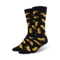 Pair of black crew socks with a whimsical all-over print of golden brown peanuts.