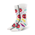 A pair of white crew socks with a 90s-themed Coca-Cola design. The socks feature red Coca-Cola logos, and teal, purple, and yellow geometric shapes.