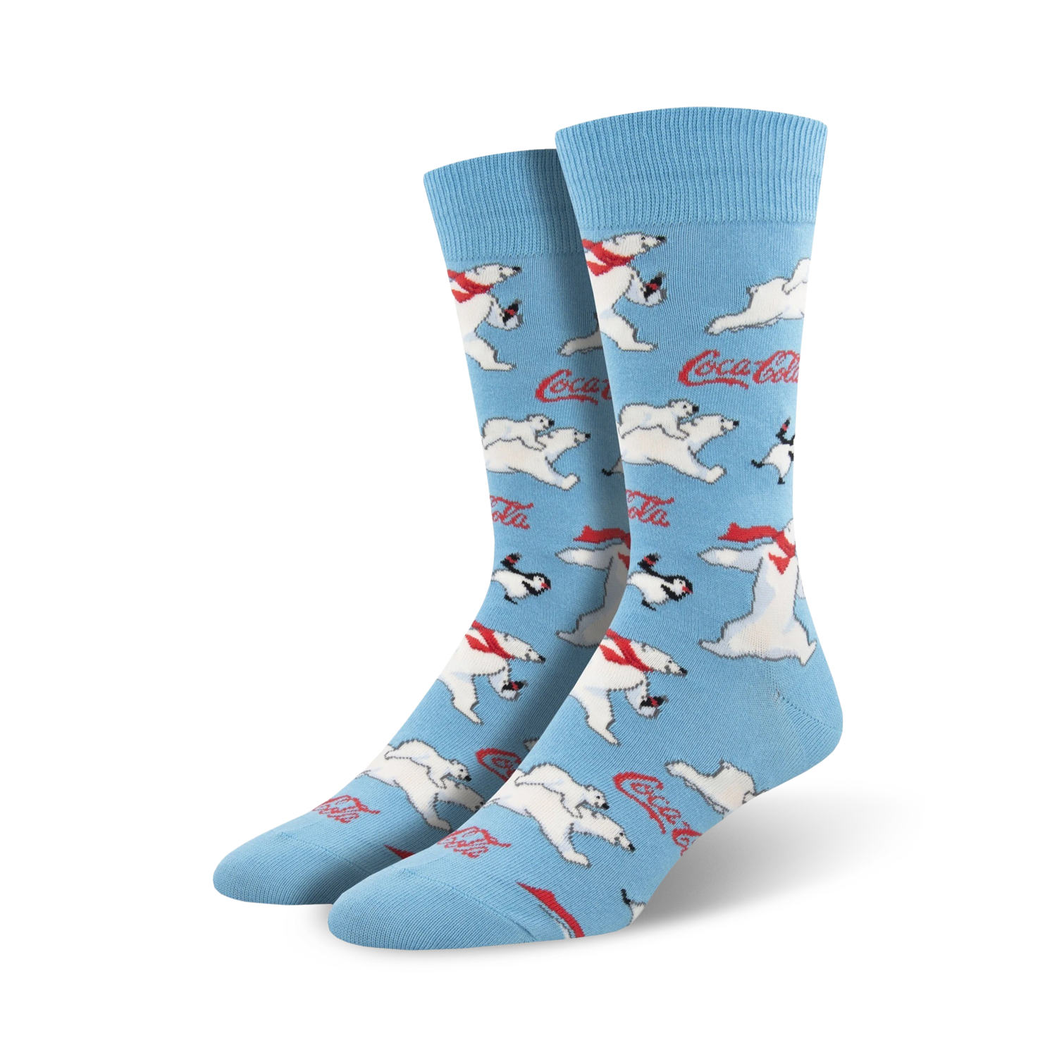 A pair of crew socks in light blue featuring a repeating pattern of polar bears, penguins, and Coca-Cola logos.