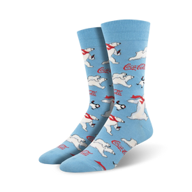 [alt text] blue crew socks with a pattern of polar bears and penguins ice skating, wearing red scarves and hats. coca-cola logo is on each sock.   
