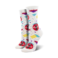Pair of white crew socks with a 90s-themed Coca-Cola design. Red Coca-Cola logo, teal and purple accents, and wavy lines on a white background.