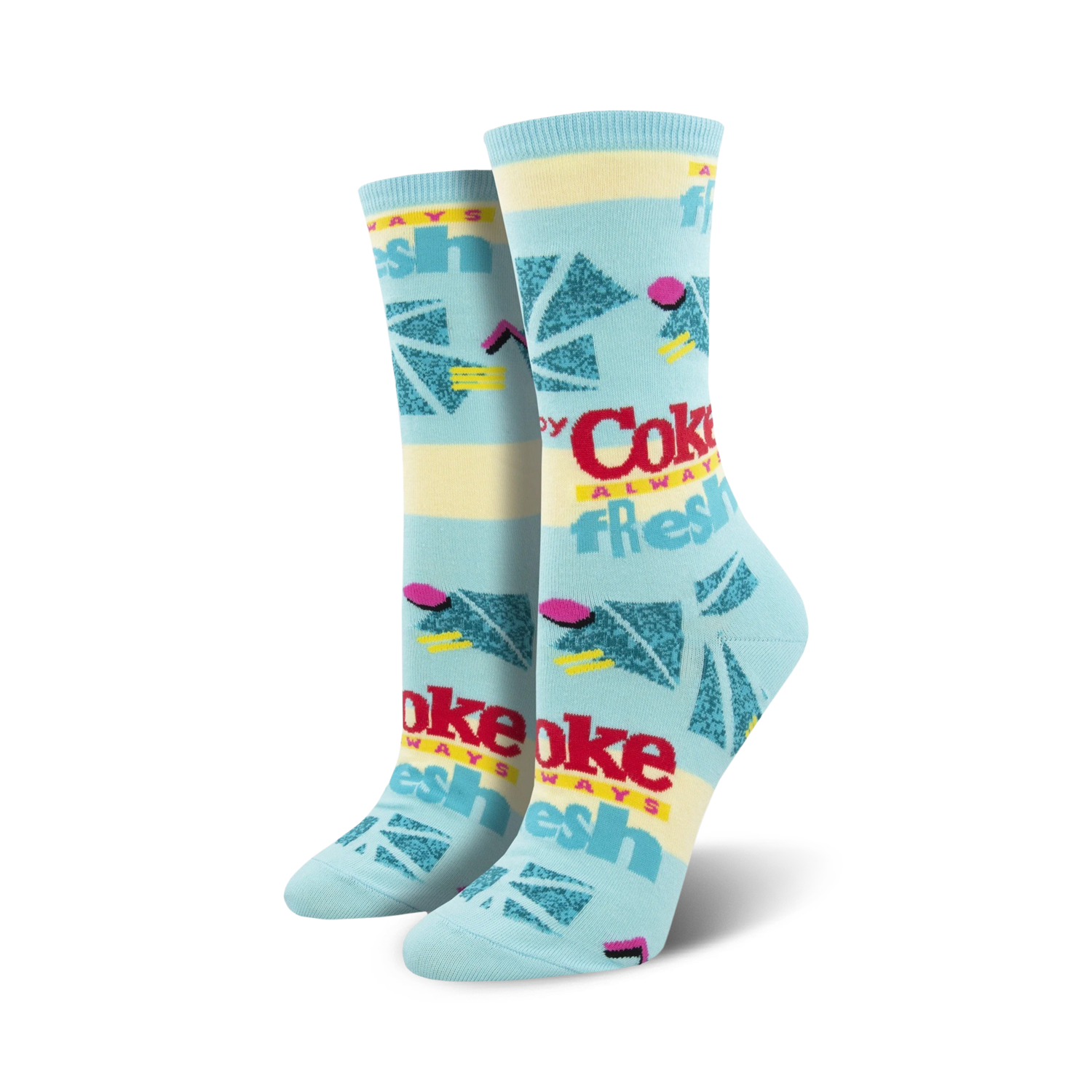 Pair of women's crew socks in pastel blue and yellow, featuring a retro Coca-Cola design with geometric shapes and the text 'Always Fresh'.