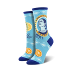 Pair of Frida Kahlo-themed crew socks. Light blue background with oranges, artistic portrait of Frida, and geometric patterns.