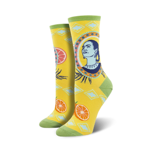 yellow crew socks for women featuring frida kahlo's portrait, blue and white diamonds, and orange slices.  