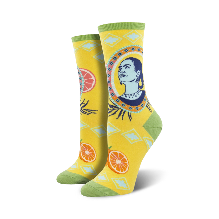 yellow crew socks for women featuring frida kahlo's portrait, blue and white diamonds, and orange slices.  